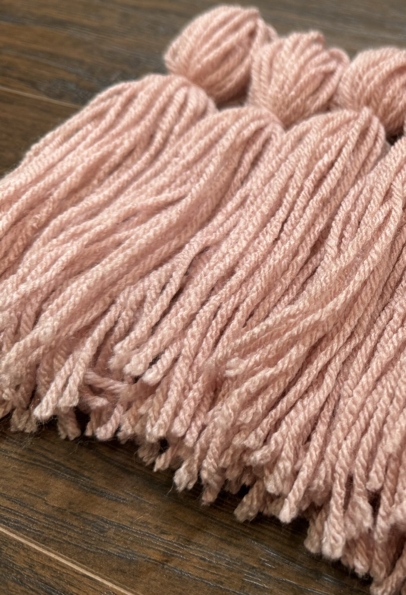 pink diy yarn tassels for crafting